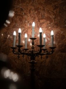 A spooky candelabra being used as Halloween apartment decor.