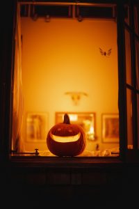 A small orange pumpkin halloween window decoration perfect for apartment renters.